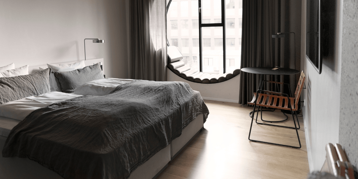 Hotel Ottilia - Deluxe Double Room with Round Window (1).png