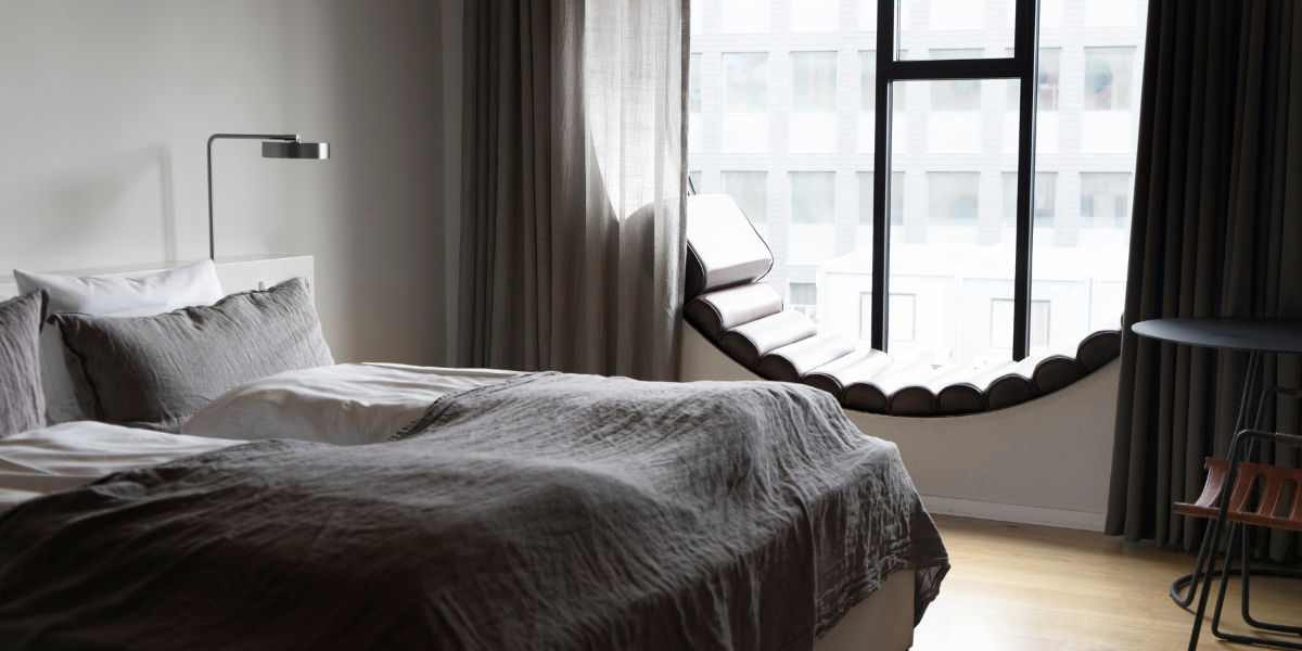 Hotel Ottilia - Deluxe Double Room with Round Window (2).png